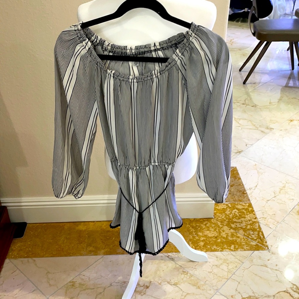 ECOTE Black and white striped off the shoulder romper.